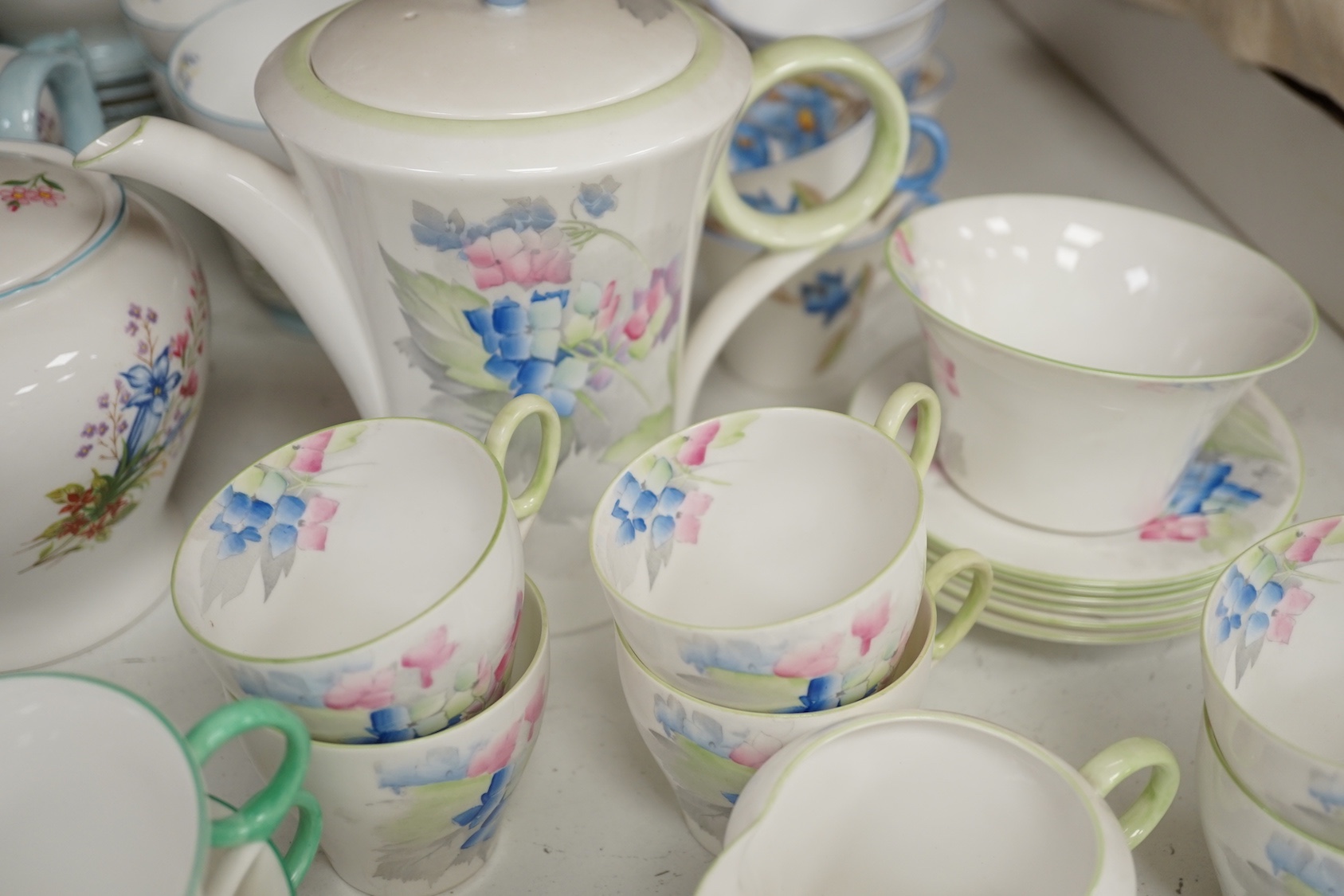 Large quantity of Shelley tea wares to include Syringo 12025, Wild Flowers 2823, Hydrangea 12318, WR 078 and Wild Flowers 13668
